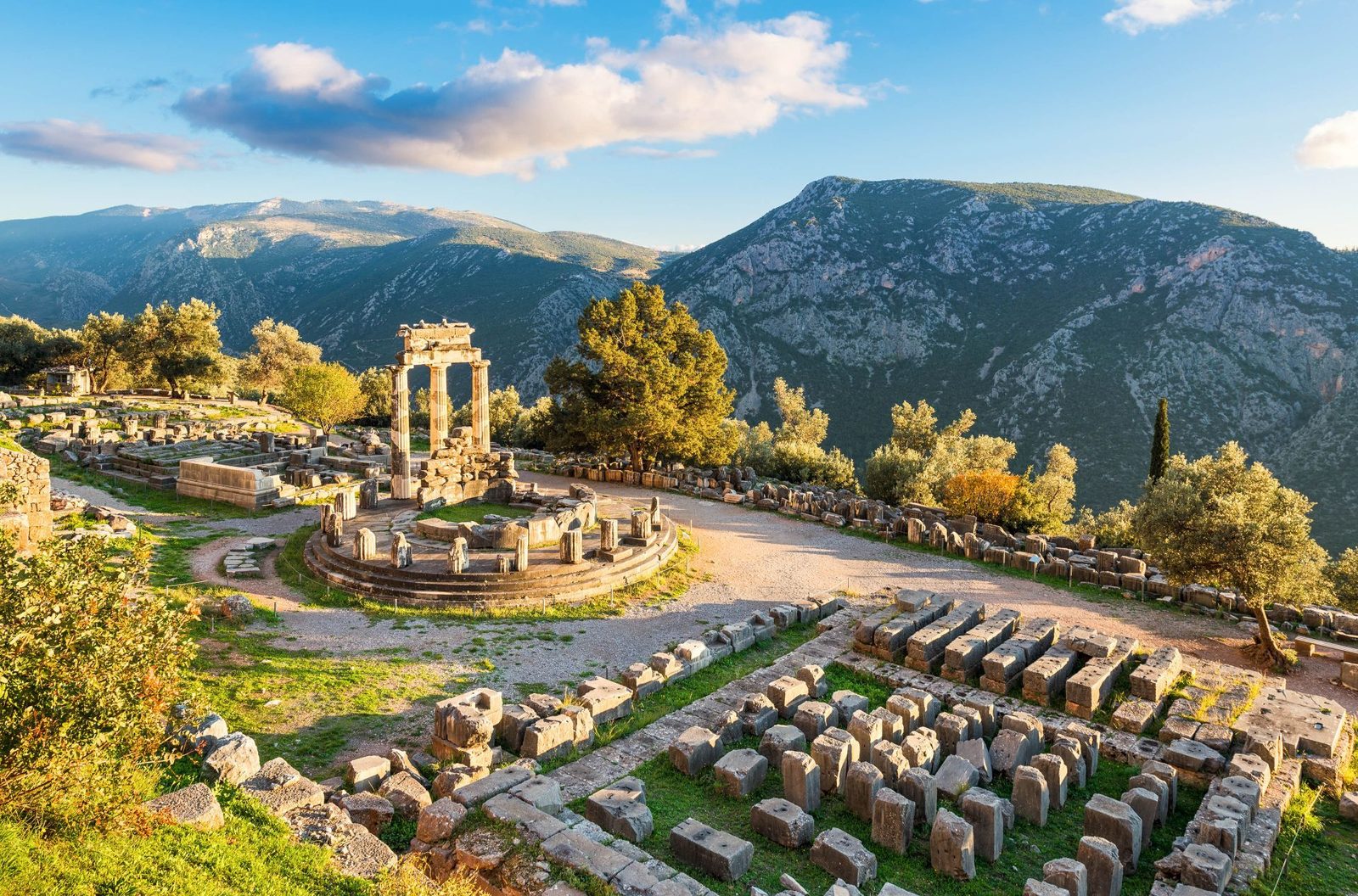 The circular Tholos at the sanctuary of Athena Pronaia, Delphi, with the mountains of Phocis behind
